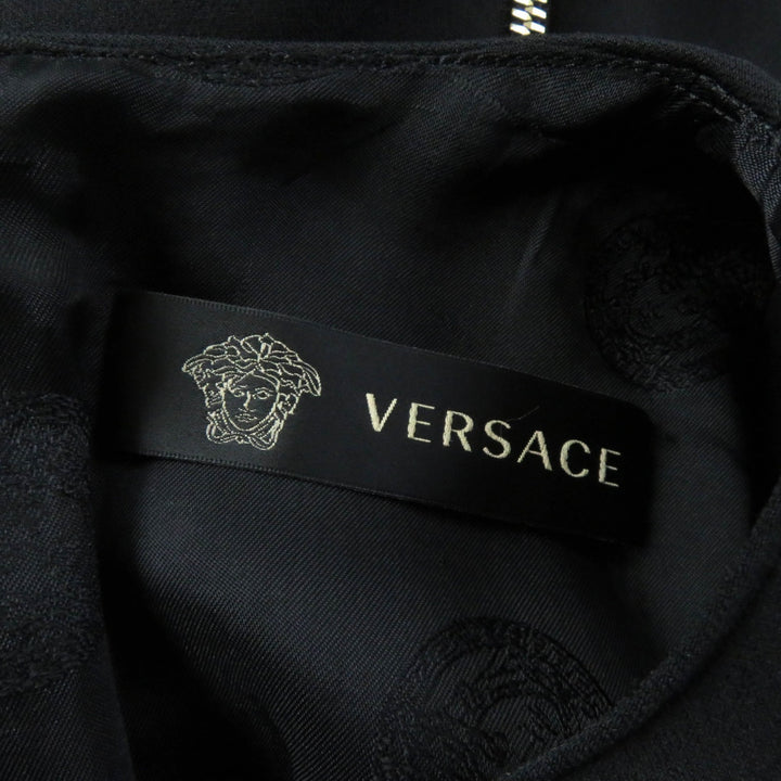 Great VERSACE one piece Medusa top, back zip, knee length, short sleeves black wool Women 40
