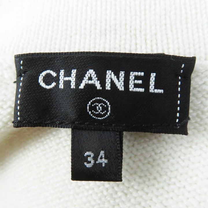 Excellent CHANEL cardigan with decorative COCO Mark buttons white cashmere Women 34 P73102