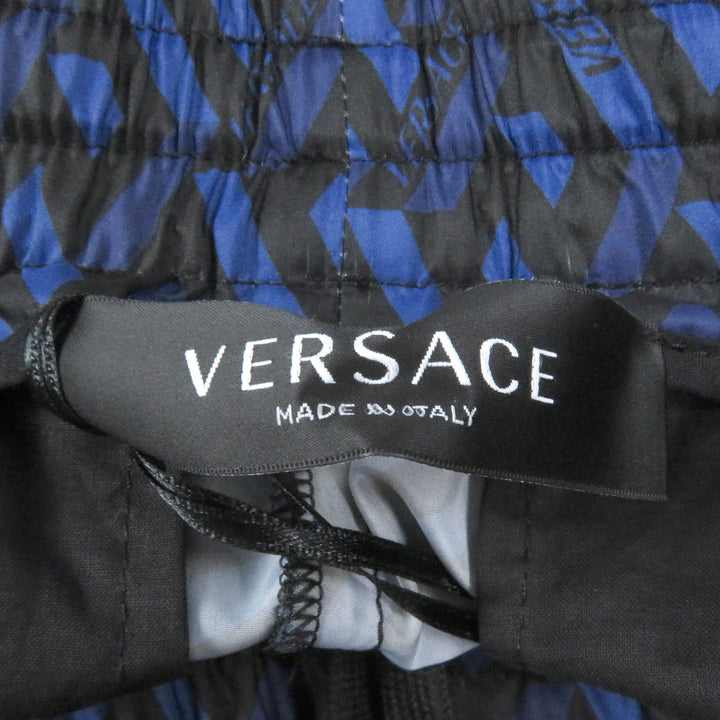 Pristine VERSACE Pants Logo-print nylon jogger pants Navy Nylon mens 52 1002482