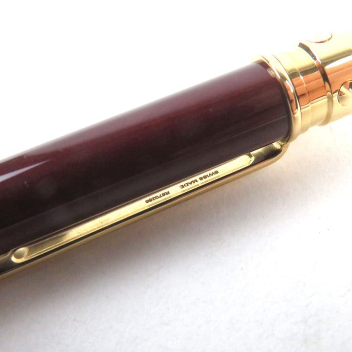 Excellent Cartier Ballpoint pen Santos de Cartier Logo engraved twist style Bordeaux gold