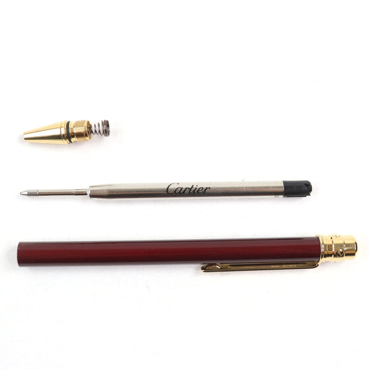 Excellent Cartier Ballpoint pen Santos de Cartier Logo engraved twist style Bordeaux gold