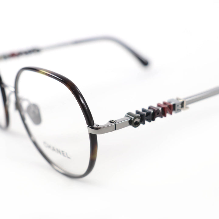 Excellent CHANEL Glasses With logo Clear brown (marble) metal Women 2213