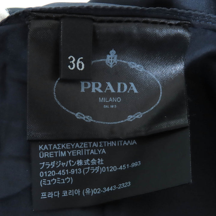 Excellent PRADA Pleated skirt Wool gabardine mini skirt with metal ring and 36