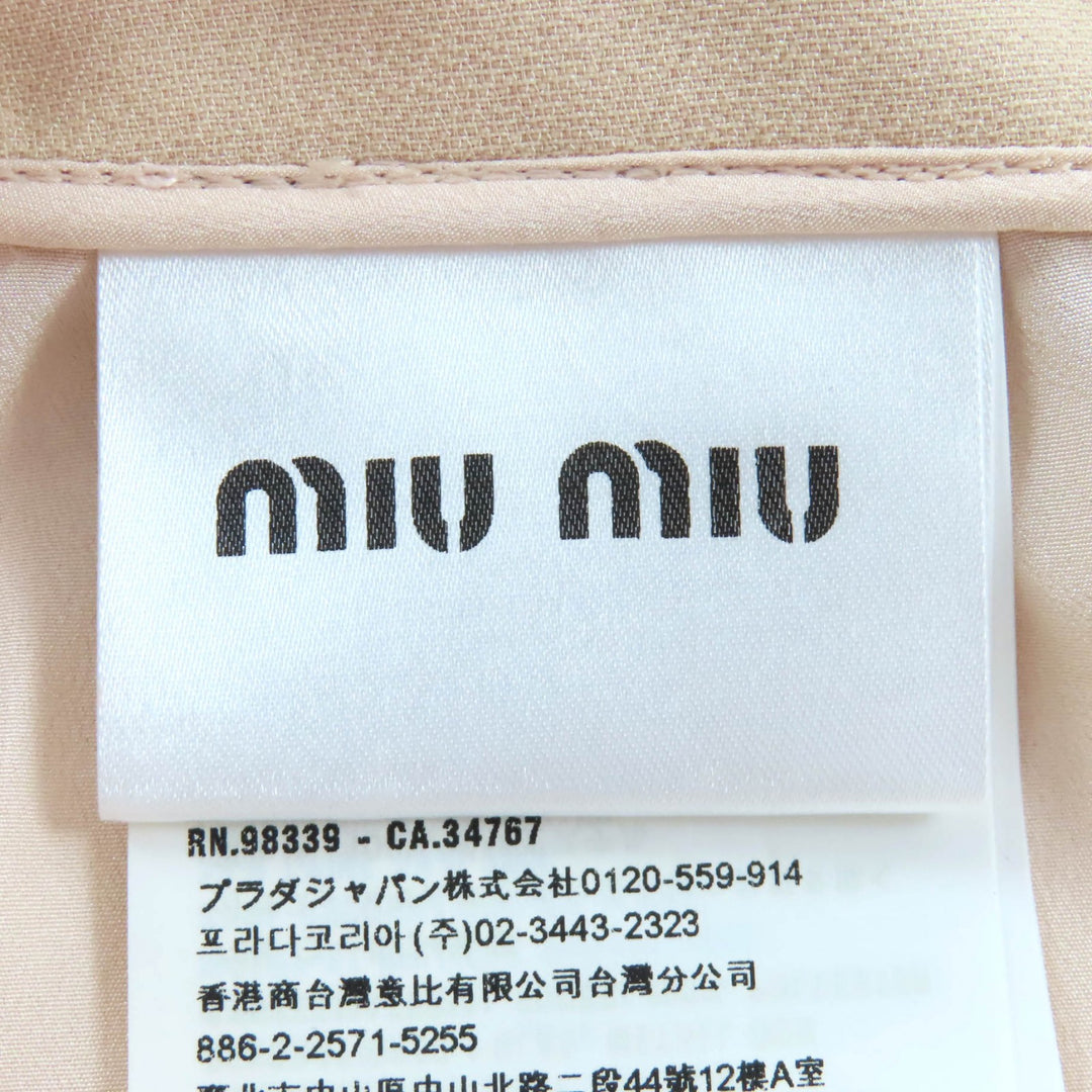 素晴らしいMIUMIUミニスカートビジューとエコパールピンクベージュウール36 MG1048
