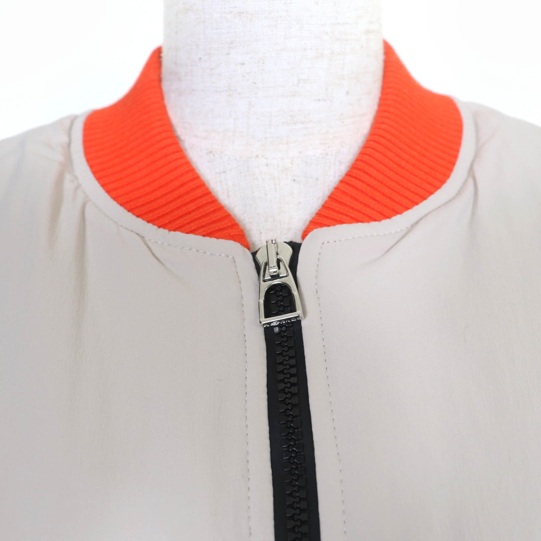 新品 HERMES ベストセリエ パッド入り ジップアップ ベージュ オレンジ ナイロン レディース M