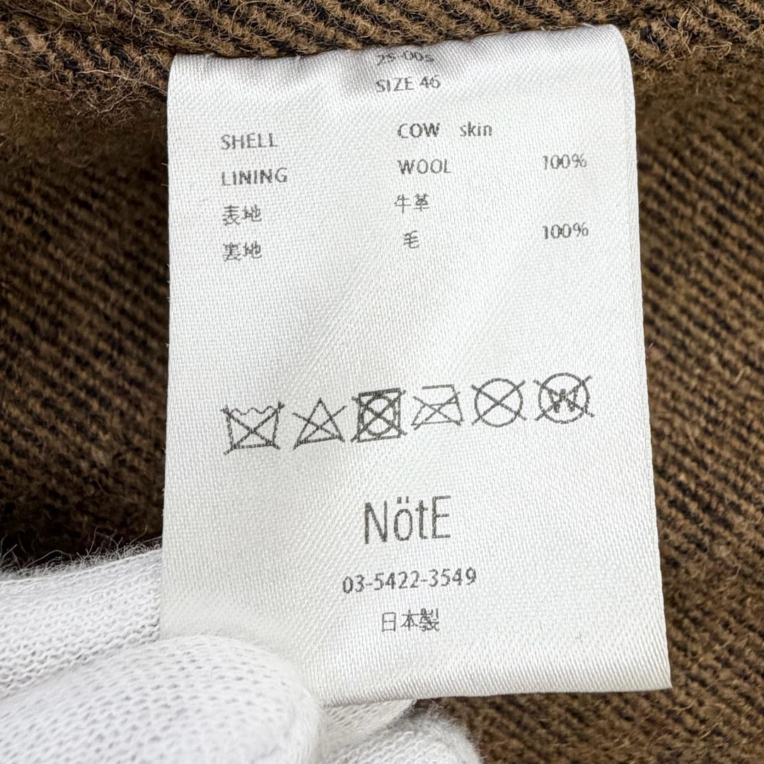 Very Good NotE coat Long leather coat with belt, 100% wool lining. 46 25-005
