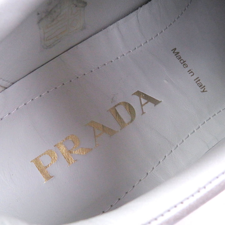Pristine PRADA Low cut sneakers Triangle logo distressed finish white