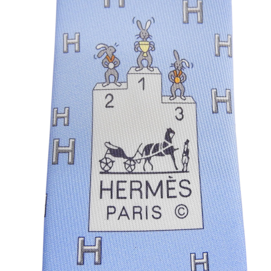 Excellent HERMES tie H-pattern Rabbit Sports Podium Light blue silk mens 6349HA