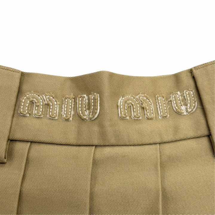 Great Miu Miu Pleated skirt West logo cut-off chinos beige cotton 40 MG1781