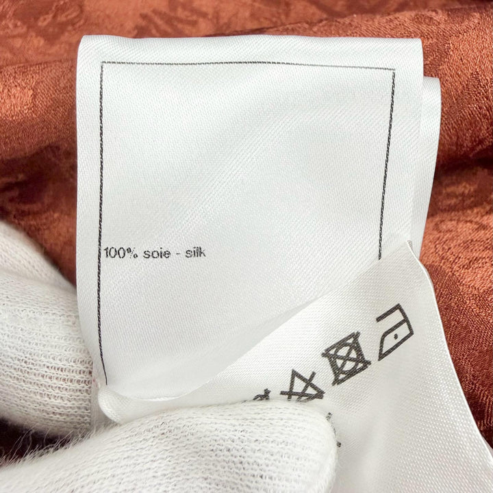 Excellent CHANEL blouse COCO Mark all-over print lion button bow tie silk FR 36