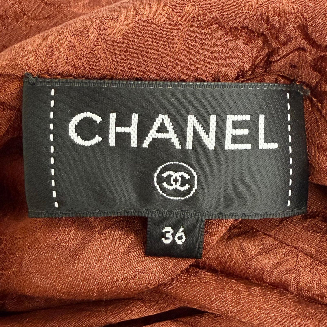 Excellent CHANEL blouse COCO Mark all-over print lion button bow tie silk FR 36