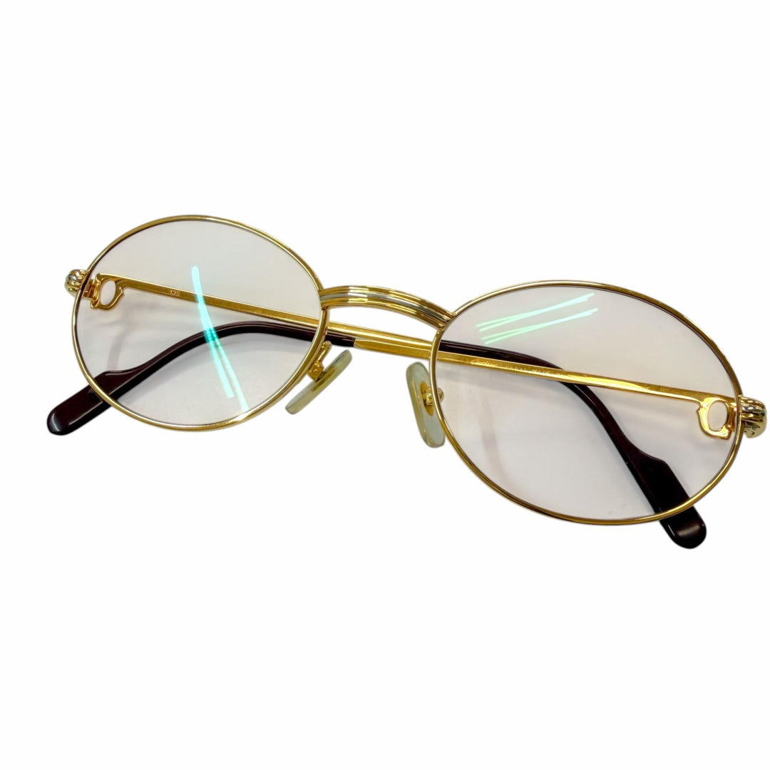 Great Cartier Glasses Trinity Oval frame with metal logo and colored lenses.