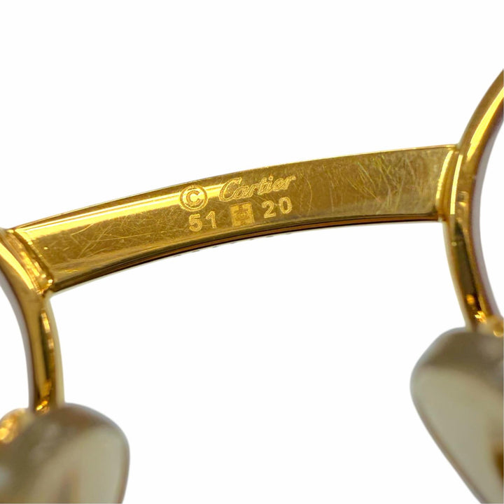 Great Cartier Glasses Trinity Oval frame with metal logo and colored lenses.
