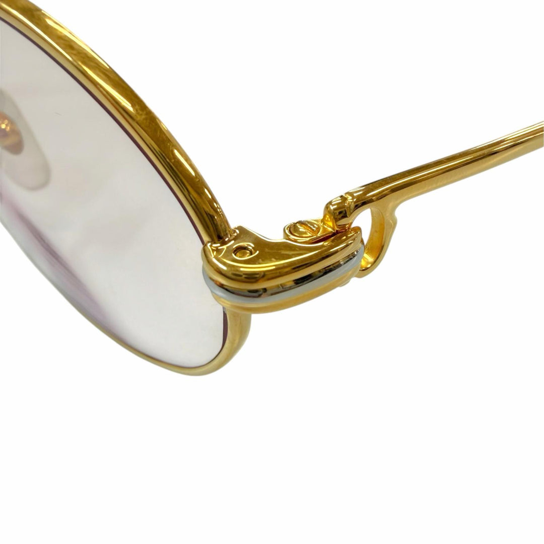 Great Cartier Glasses Trinity Oval frame with metal logo and colored lenses.