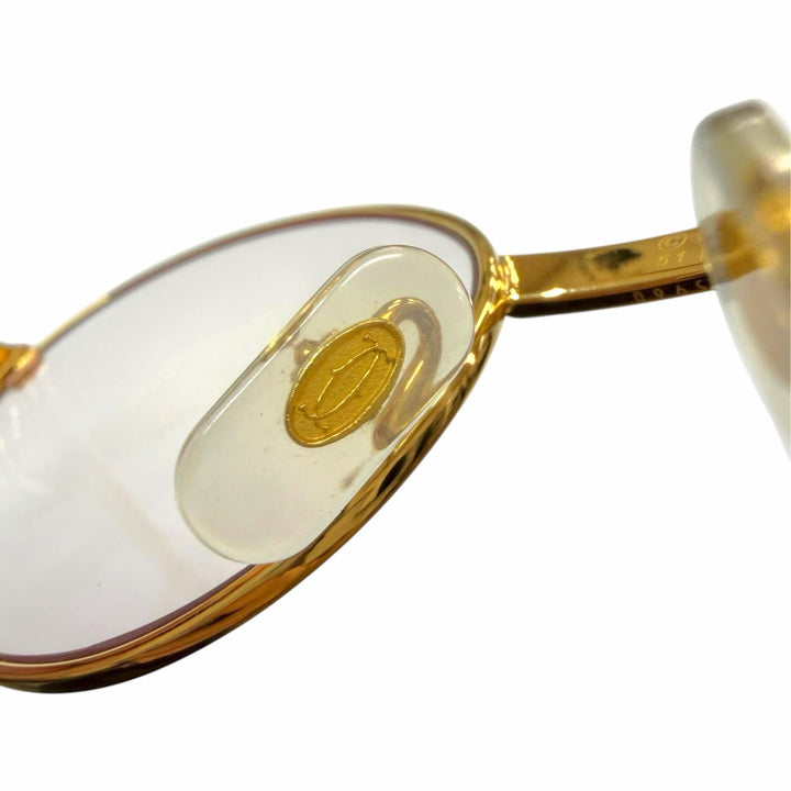 Great Cartier Glasses Trinity Oval frame with metal logo and colored lenses.